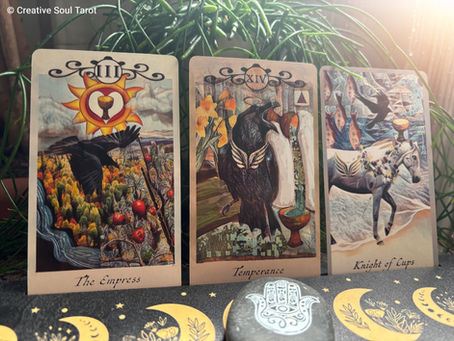 Three tarot cards: The Empress, Temperance, and Knight of Cups, featuring vivid illustrations of nature, balance, and a horse, set on a leafy background.