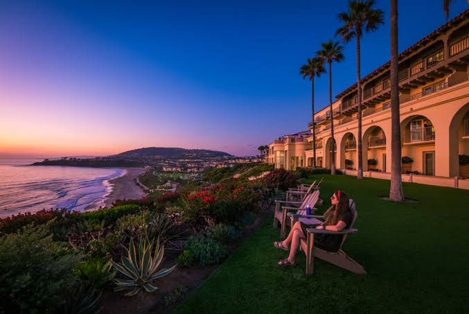 Ritz-Carlton Laguna Niguel oceanfront hotel at sunset showing coastal commercial property where window tinting helps manage sun exposure and guest comfort