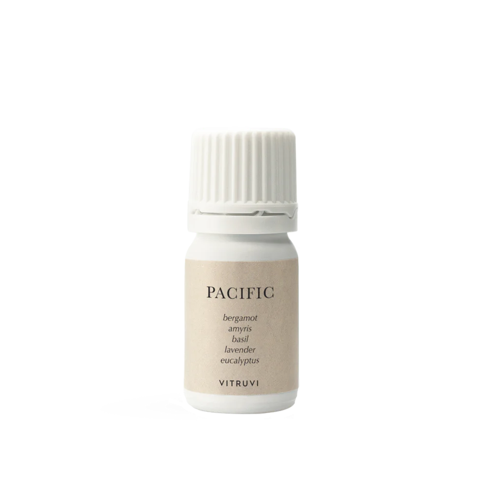Vitruvi Pacific roll-on essential oil blend in a sleek neutral-toned bottle, designed for calming aromatherapy on pulse points