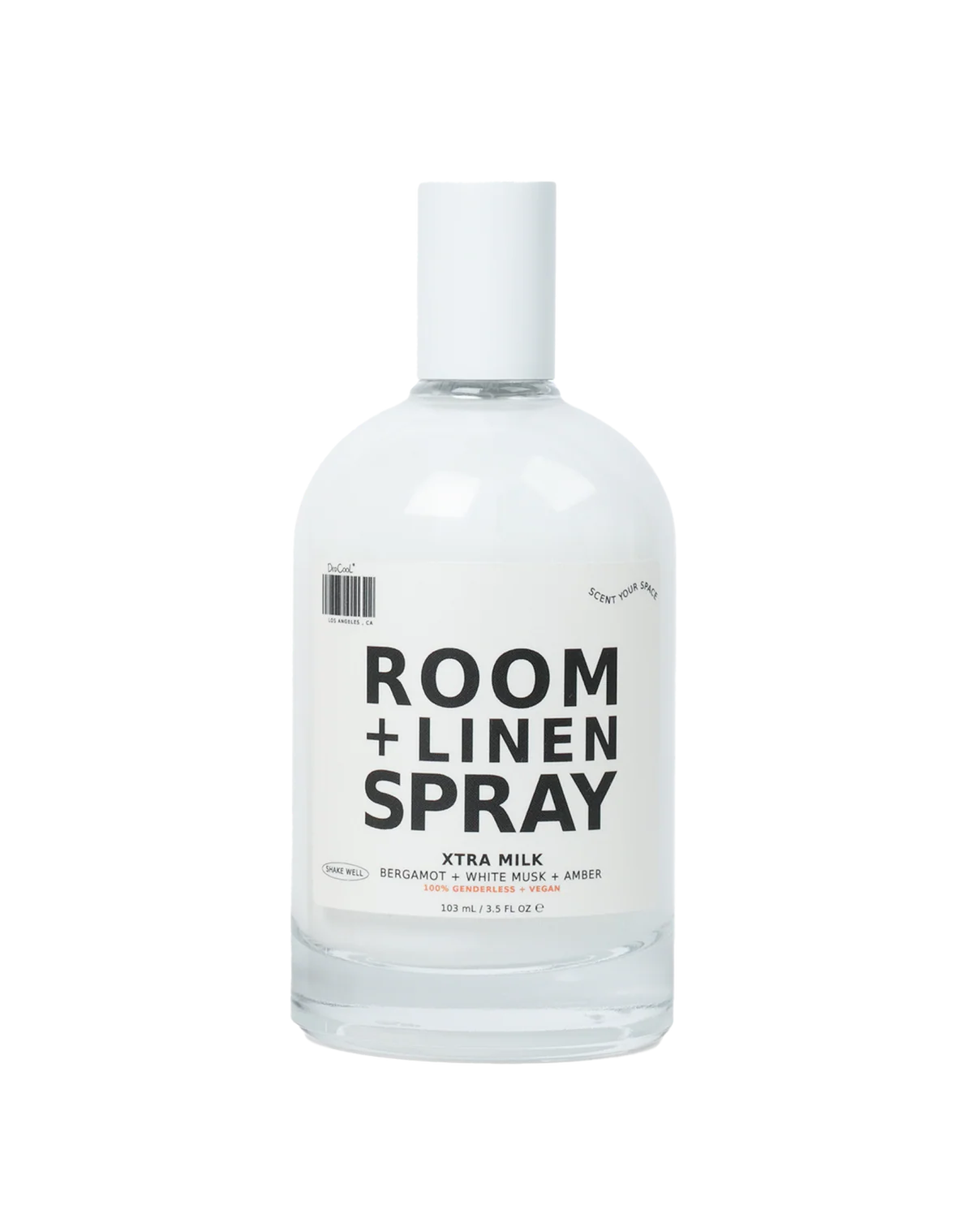 DedCool Milk room and linen spray in its sleek, modern bottle styled against a soft, neutral setting, highlighting its fresh, musky home fragrance vibe.