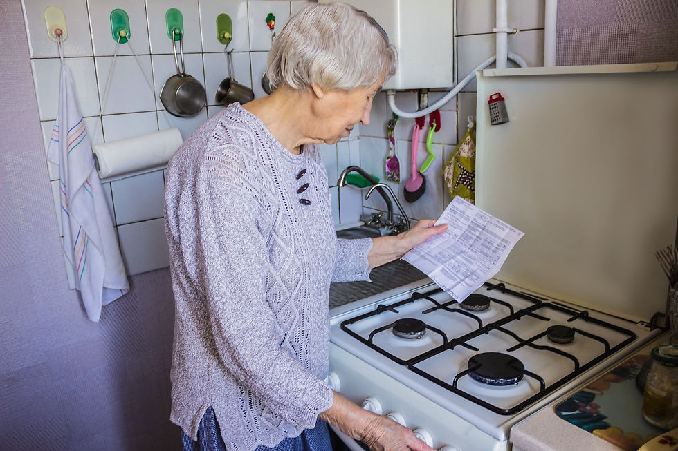 A senior looks at their rising energy bills