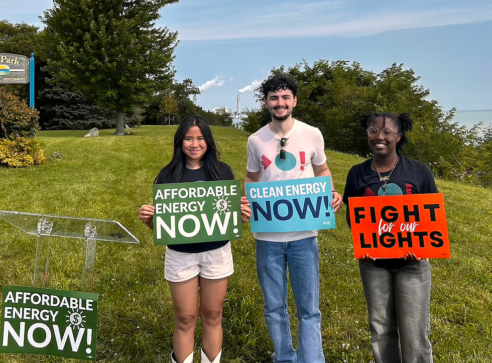 Wisconsin residents hold signs opposing expensive gas plants