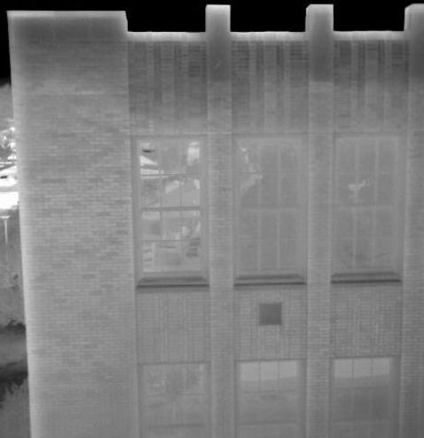 John Rogers High School-Moisture saturation at top of walls.