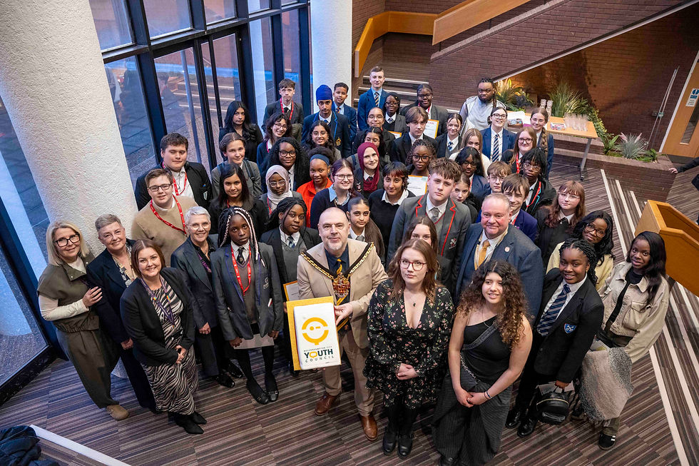 Youth Council members celebrate their election success with council officials.