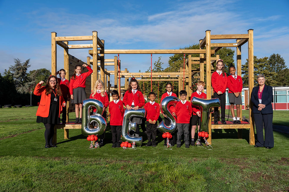 Celebrating their Ofsted success are D’Eyncourt Primary School pupils with, left, Headteacher Danielle Darby and, right, Councillor Jacqui Coogan, Cabinet Member for Children, Young People and Education.