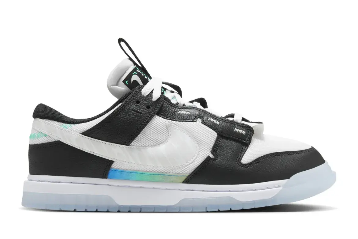 Black and white Nike Dunk Low sneaker with iridescent stripe on sole.