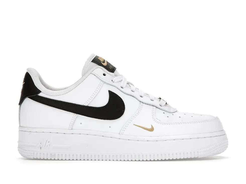 White Nike Air Force 1 shoe, black swoosh, gold mini swoosh.