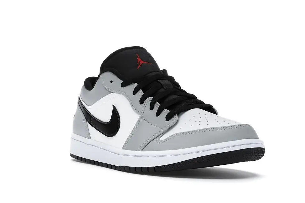 White, grey, black Air Jordan 1 Low with red Jumpman logo.