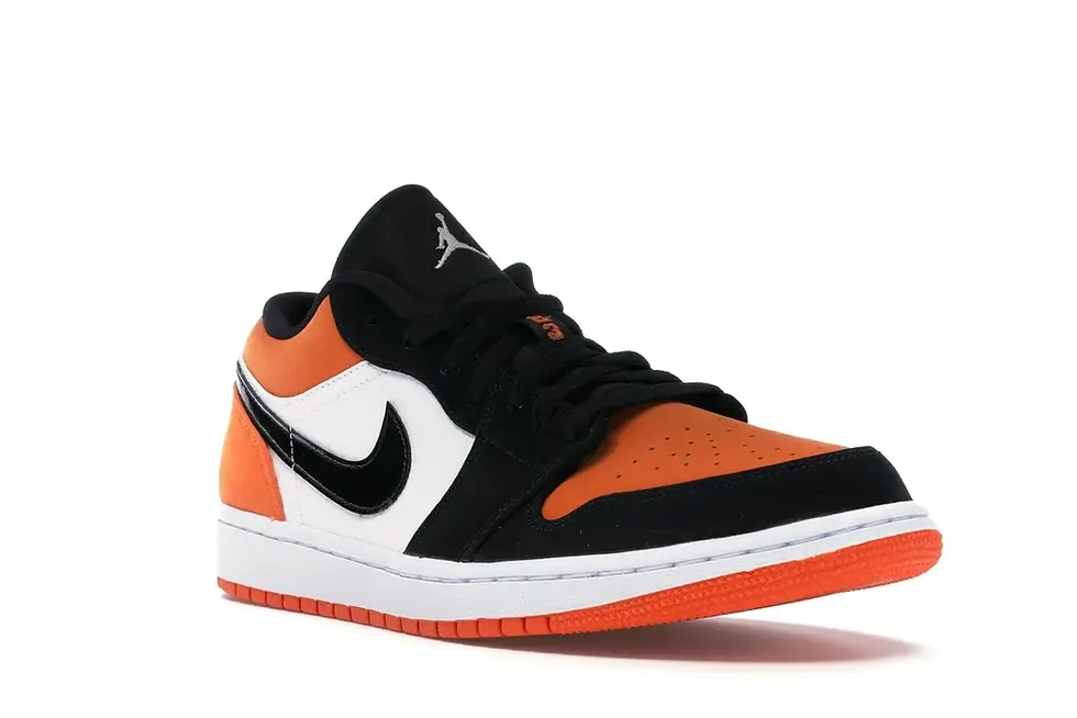 Air Jordan 1 Low black, white, orange low-top sneaker.