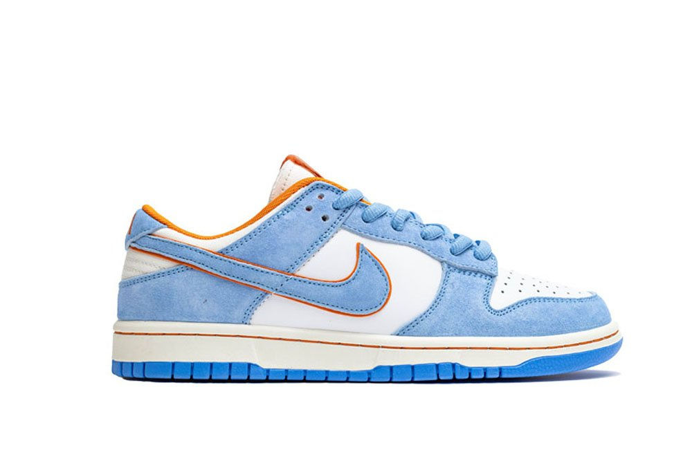 Blue and white Nike Dunk Low sneaker with orange accents and sole.