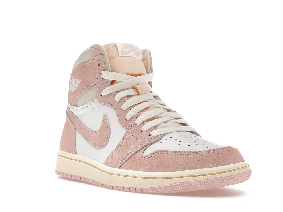 Pink and white high-top sneaker with cream laces on a white background.