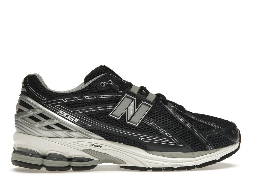 Black New Balance 1906R sneaker with silver N logo and N-ERGY sole.