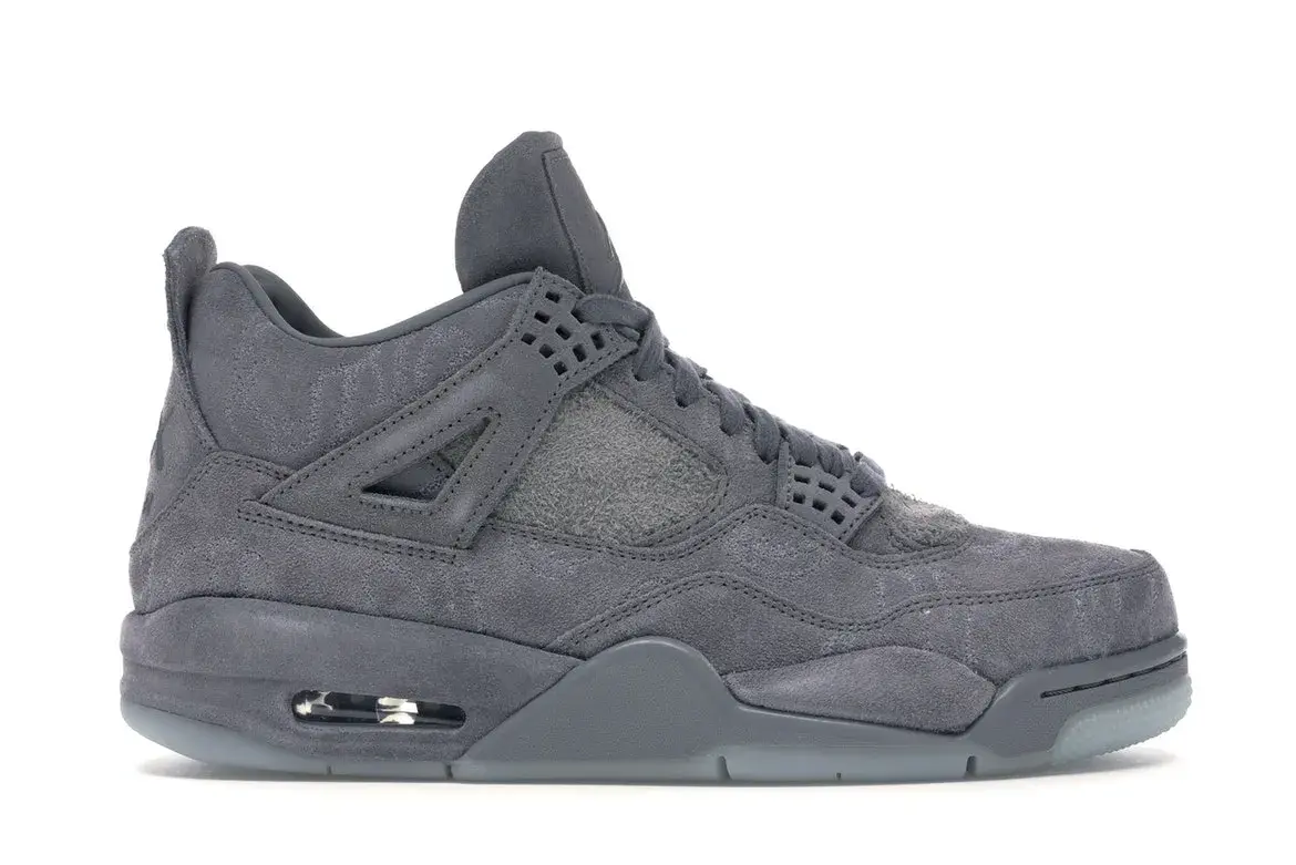 Side view of a single dark grey Air Jordan 4 sneaker.