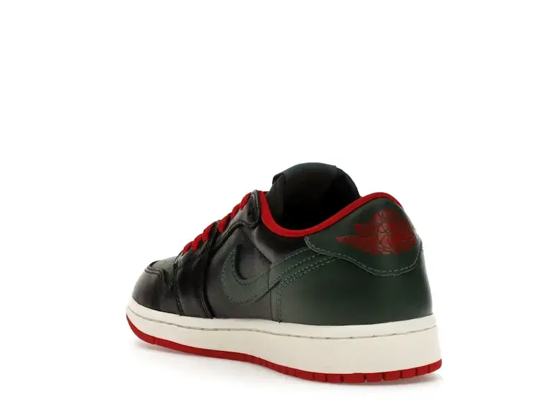 Black and dark green low-top sneaker with red laces and white midsole.