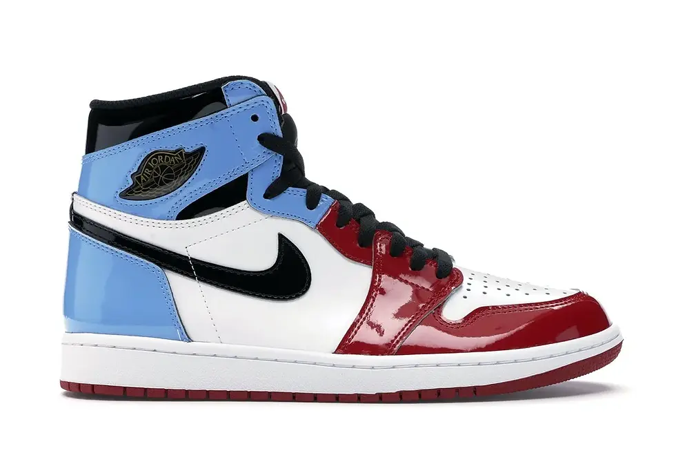 Shiny Air Jordan high-top sneaker in UNC blue, white, and red.