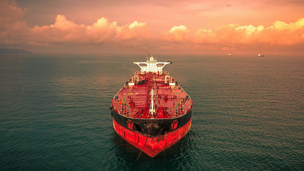 Stunning aerial photo of a large red tanker ship on the ocean at sunset, highlighting the maritime transportation of liquids and the beauty of naval operations.