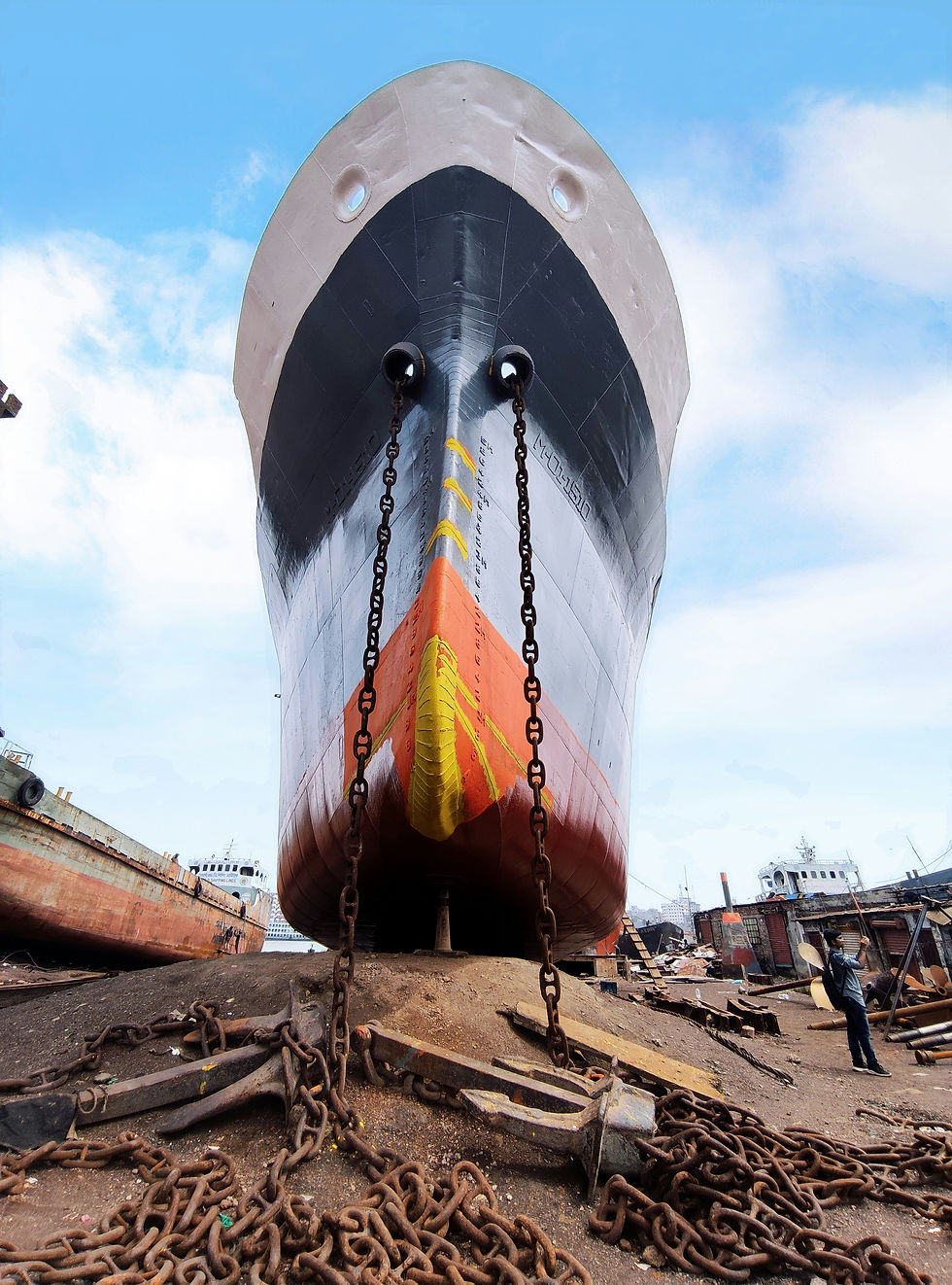 Large ship in a dry dock for dry docking maintenance, showing the hull and anchor chains. Dry docking is essential for vessel inspections and repairs."