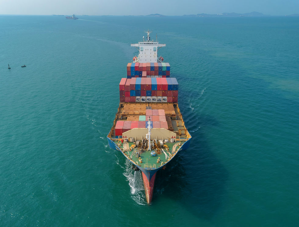 Aerial view of a large container ship loaded with colorful containers sailing through blue ocean waters, illustrating modern global maritime trade and shipping logistics.