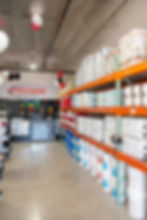 Shelves stocked with products in the storeroom.