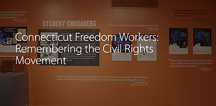 Image of gallery wall with photos from exhibit and commentary. Title of exhibit on top of image.