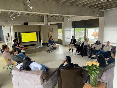 Reunion in the center of the space, with many people sitting in a circular shape