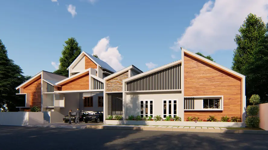 Exterior view of a contemporary house showcasing a unique sloping roof design, red brick accent walls, and an open front yard under a clear blue sky.