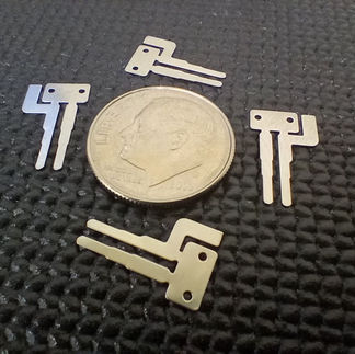 Highly detailed micro progressive die stamped part from progressive die.