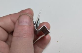 Deformed metal clip 