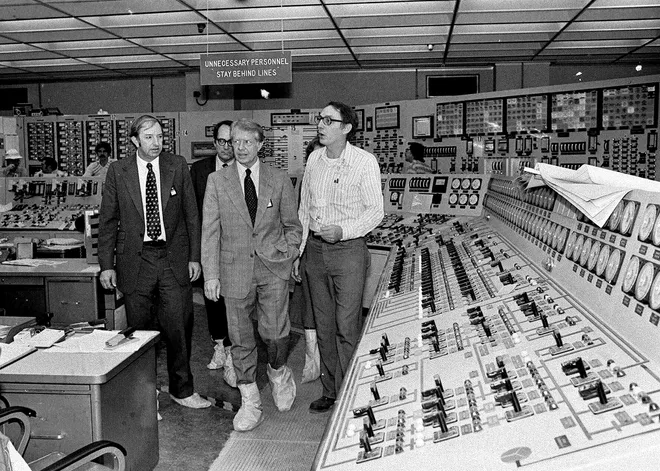 Wearing protective boots, then President Carter, center right, accompanied by Dr. Harold Denton, then Director of the U.S. Nuclear Agency, left, and then Pennsylvania Gov. Dick Thornburg, left-rear, tour the control room of the Three Mile Island nuclear plant in Middletown, Pa. on April 1, 1979, four days after the nuclear accident. AP Photo, York Daily Record