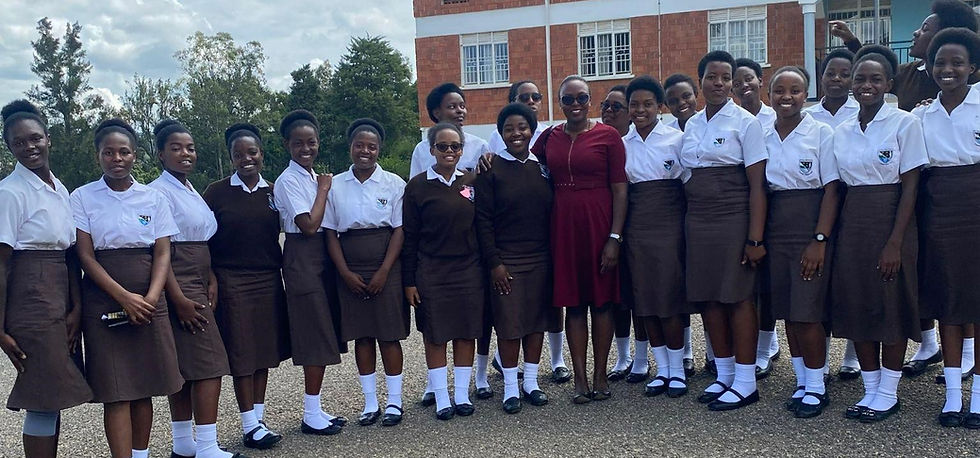 Fortunate (center, red dress) with some of the students who attended her talk.
