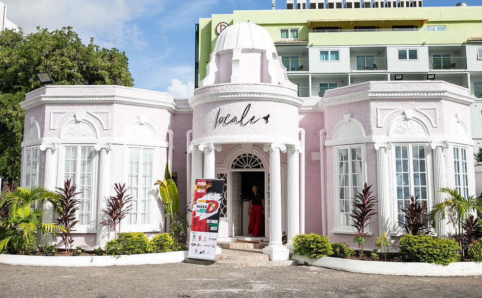 pink boutique with orange facade surrounded by greenery
