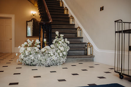 modern style floral installation on staircase of St. Tewdrics House