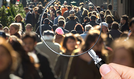 People seen through magnifying glass.jpg