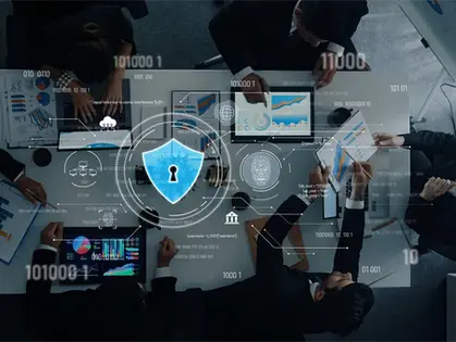 Professionals focused on cybersecurity analytics, analyzing digital data and graphs on laptops