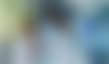 Three clinical residents evaluating a scan result.