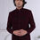 Thumbnail: Full-length view of a man wearing a designer monochromatic dark red sherwani suit, showcasing the layered look