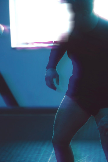 silhouette of grappler against a bright window 