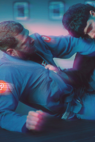 two jiu jitsu grapplers sparring
