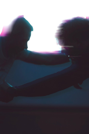 silhouette of grapplers wrestling 
