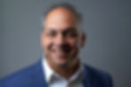 An executive headshot capturing the essence of leadership and professionalism