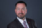 An executive headshot capturing the essence of leadership and professionalism