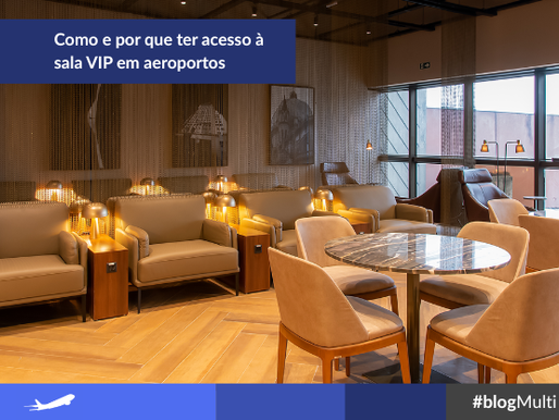 Uma sala, com poltronas, mesa de granito e cadeiras estofadas bege claro em volta. A iluminação é amarelada e acolhedora.