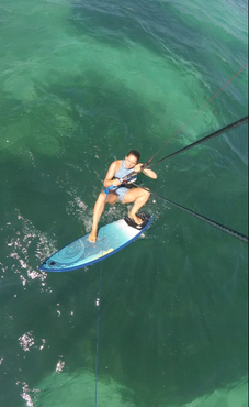 Place your feet to the board. (The inserts for foot straps give you a hint where to place your feet at the beginning).  
