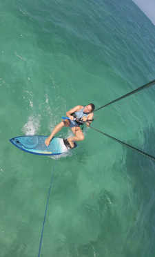 Place your feet to the board. (The inserts for foot straps give you a hint where to place your feet at the beginning).  