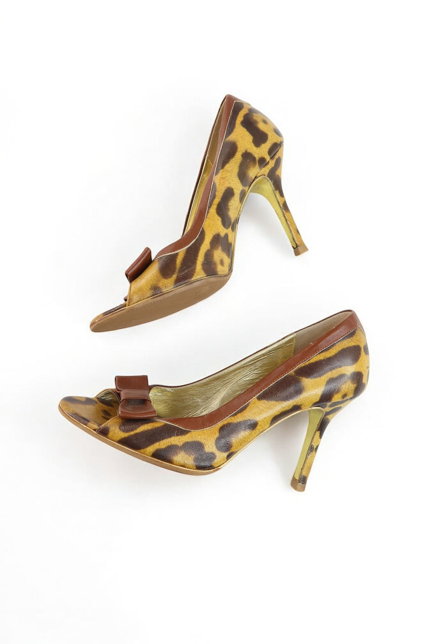 Pair of brown and yellow leopard print peep-toe heels with a bow detail