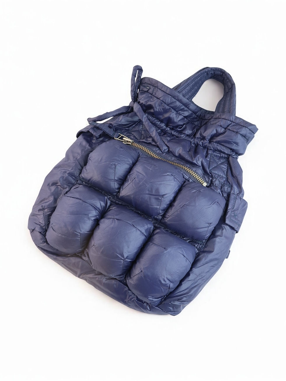 Blue quilted backpack with a zipper and drawstring closure