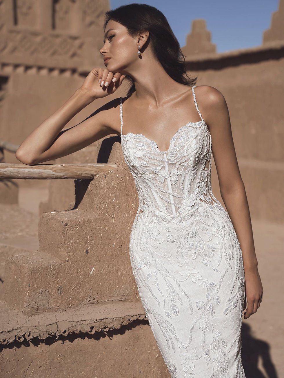 Close up of Blue by Enzoani Thao beaded lace sheath wedding dress with delicate straps and lace up corset back