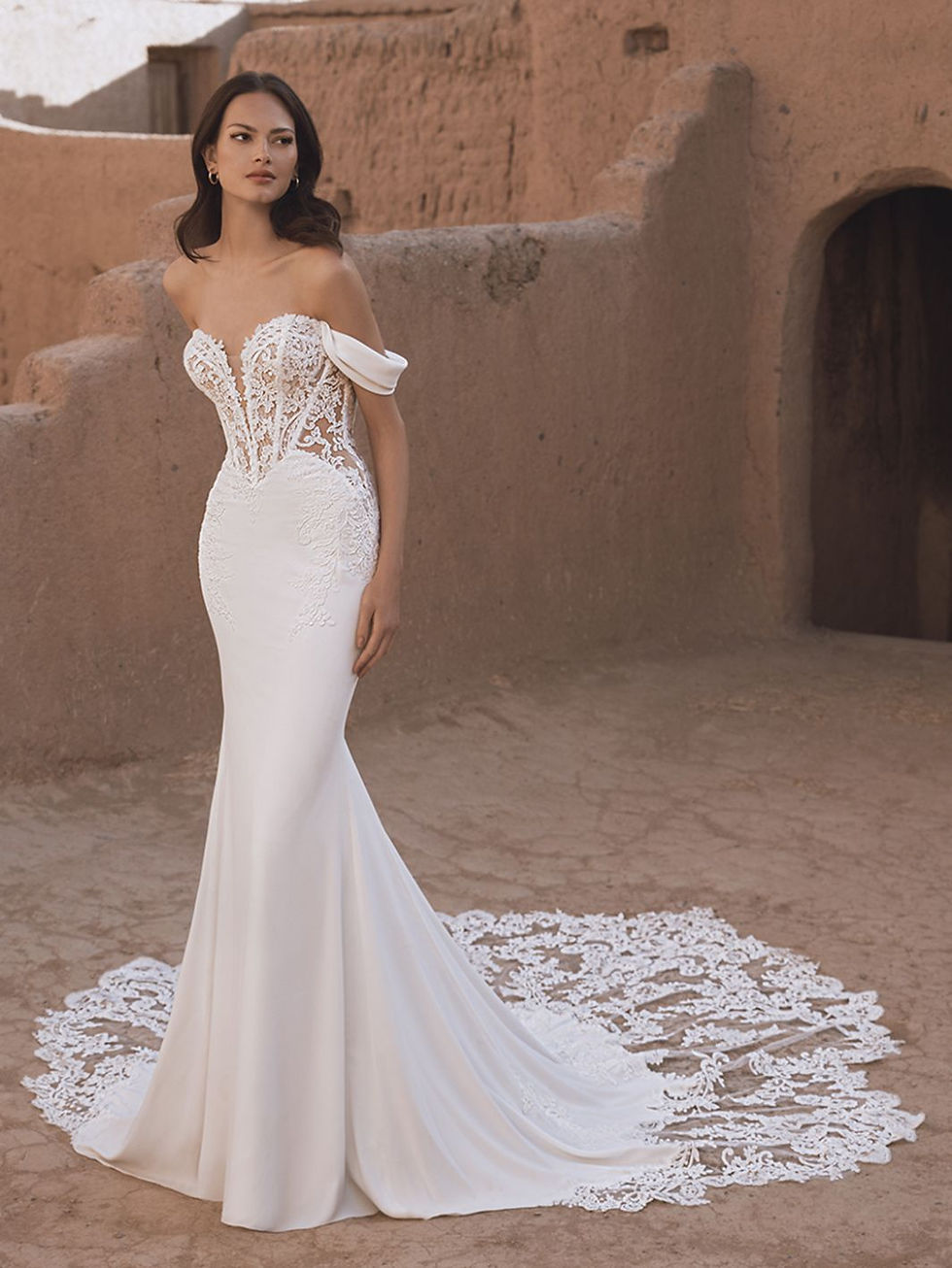 Front view of Blue by Enzoani Tammy stretch georgette and baroque lace wedding dress with detachable off shoulder cap sleeves