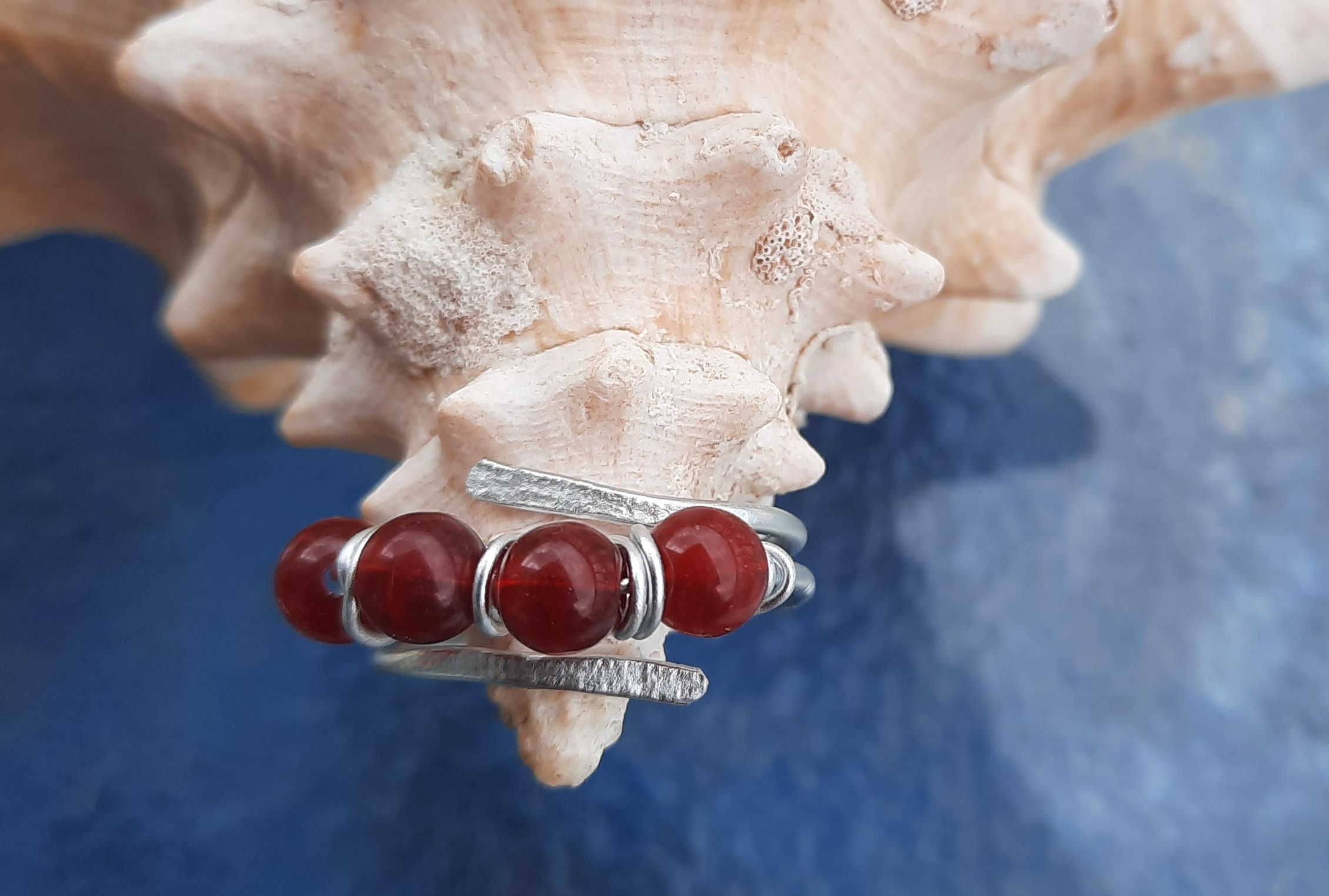 Triple wrap adjustable paddle ring