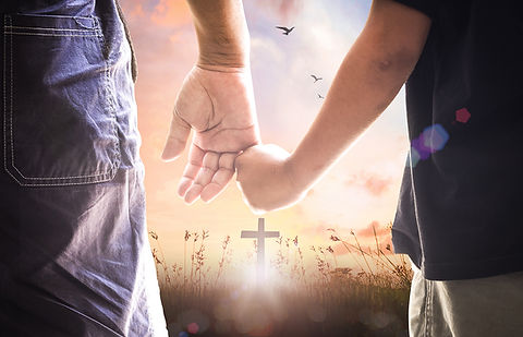 Father and Child looking at cross in the distance